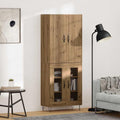 Hochschrank mit geschlossenem Stauraum und Metallgriffen